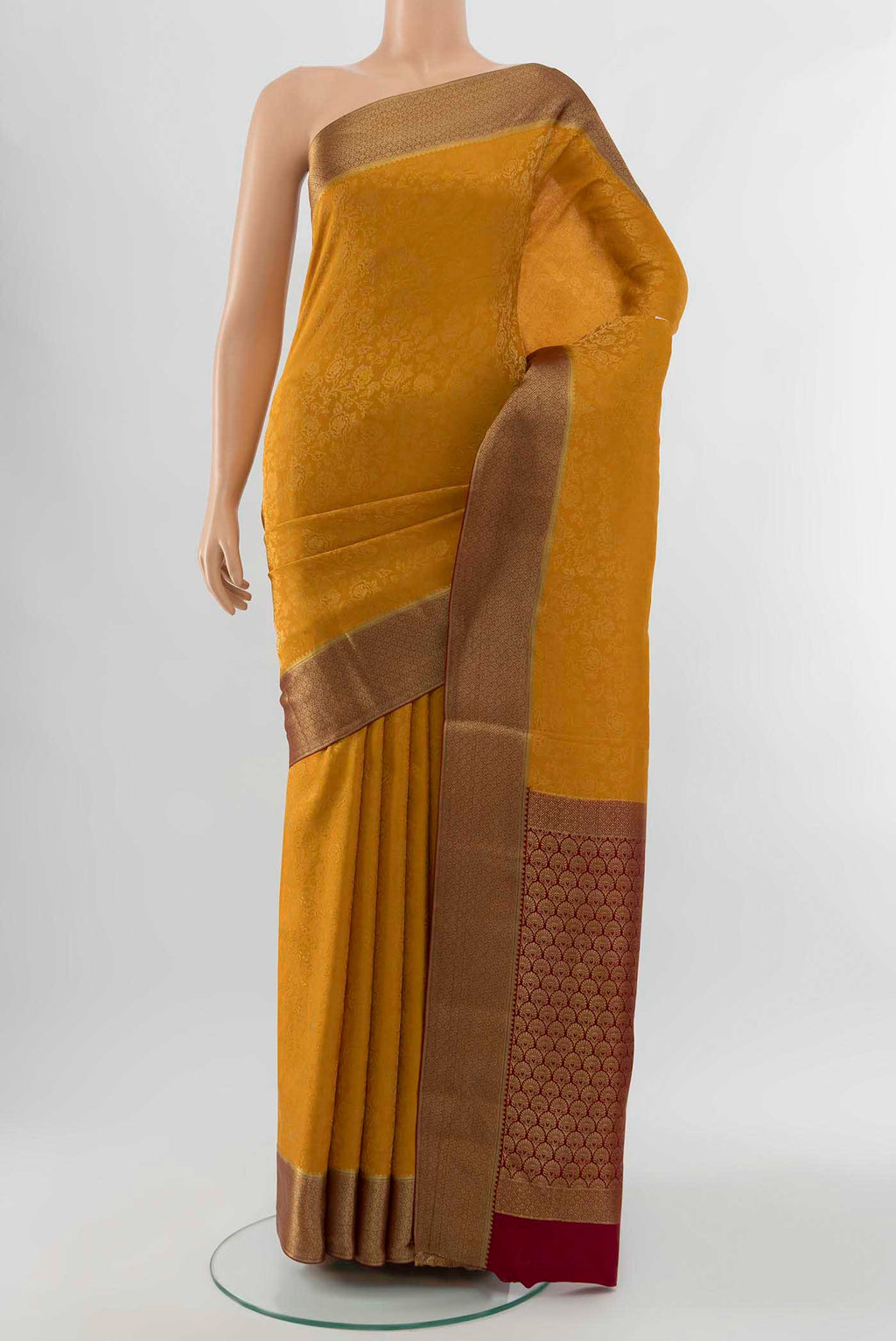 Mustard Mysore Crepe Saree with Zari Butta on the body and Silk Border displayed on a mannequin