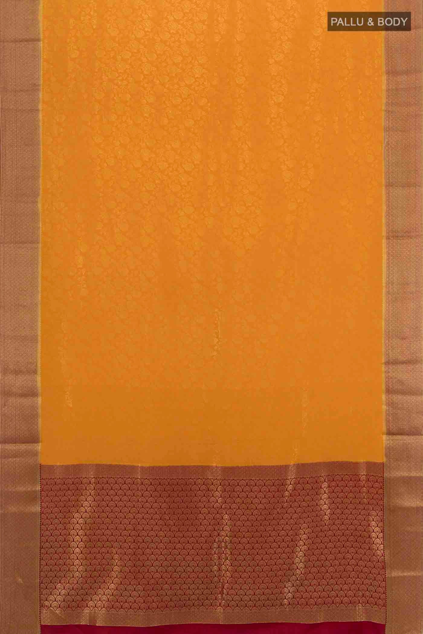 Flat view of Mustard Mysore Crepe Saree with Zari Butta on the body and Silk Border