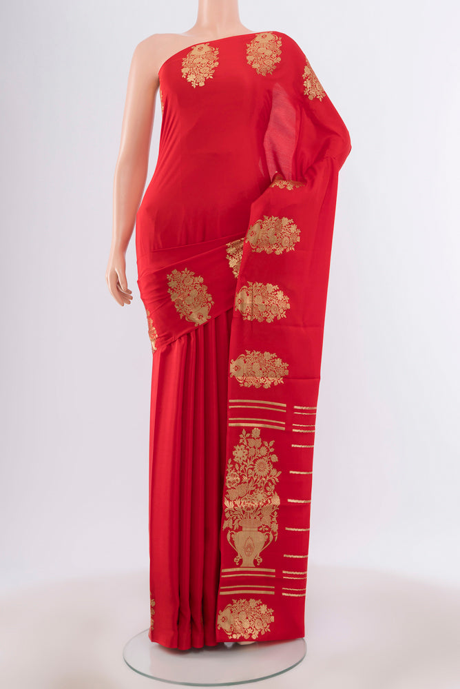 Red Mysore Crepe Saree with Zari Butta on the body and Silk Border.  displayed on a mannequin