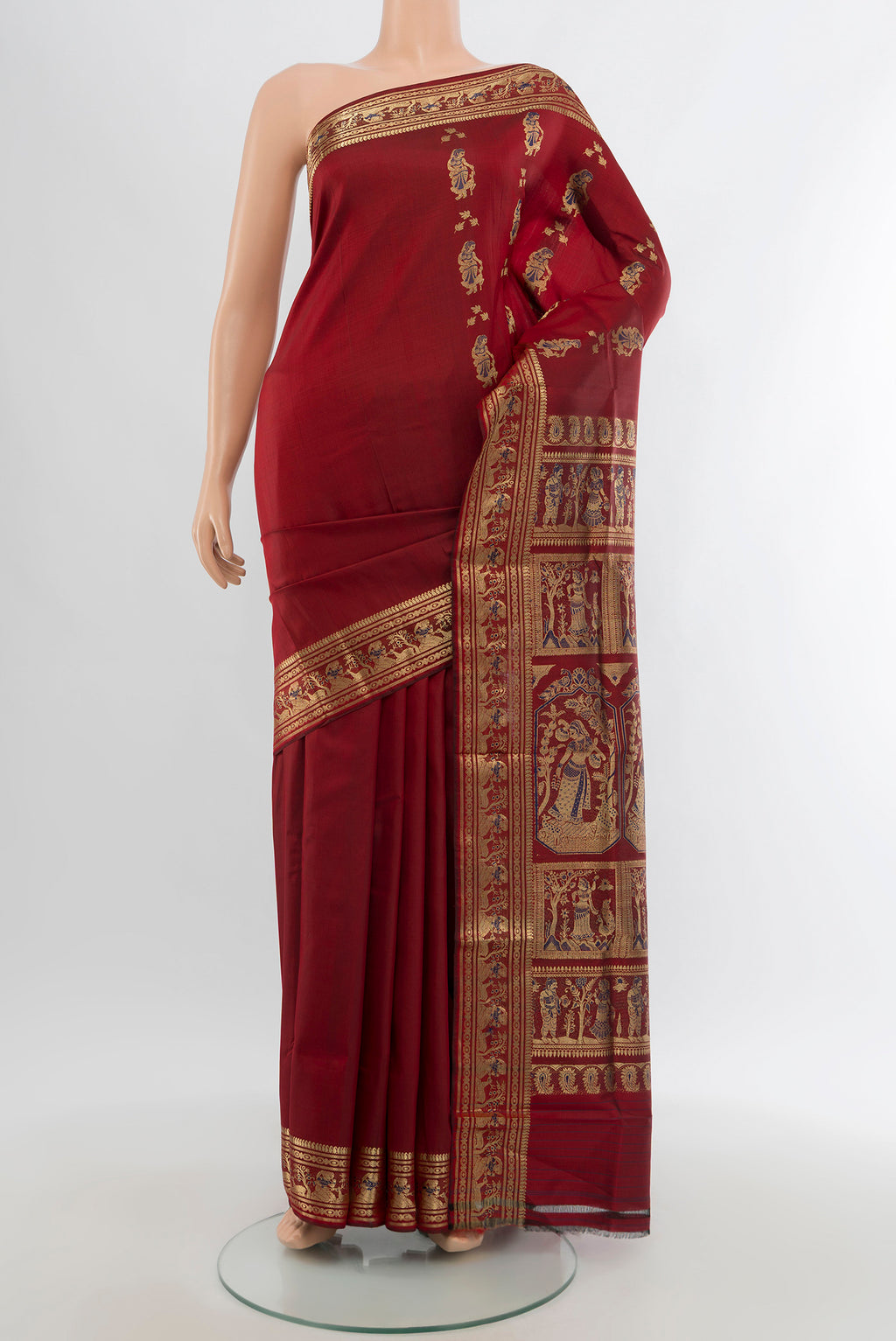 Maroon Baluchari Silk Saree with Zari Butta on the body and Zari Border.  displayed on a mannequin