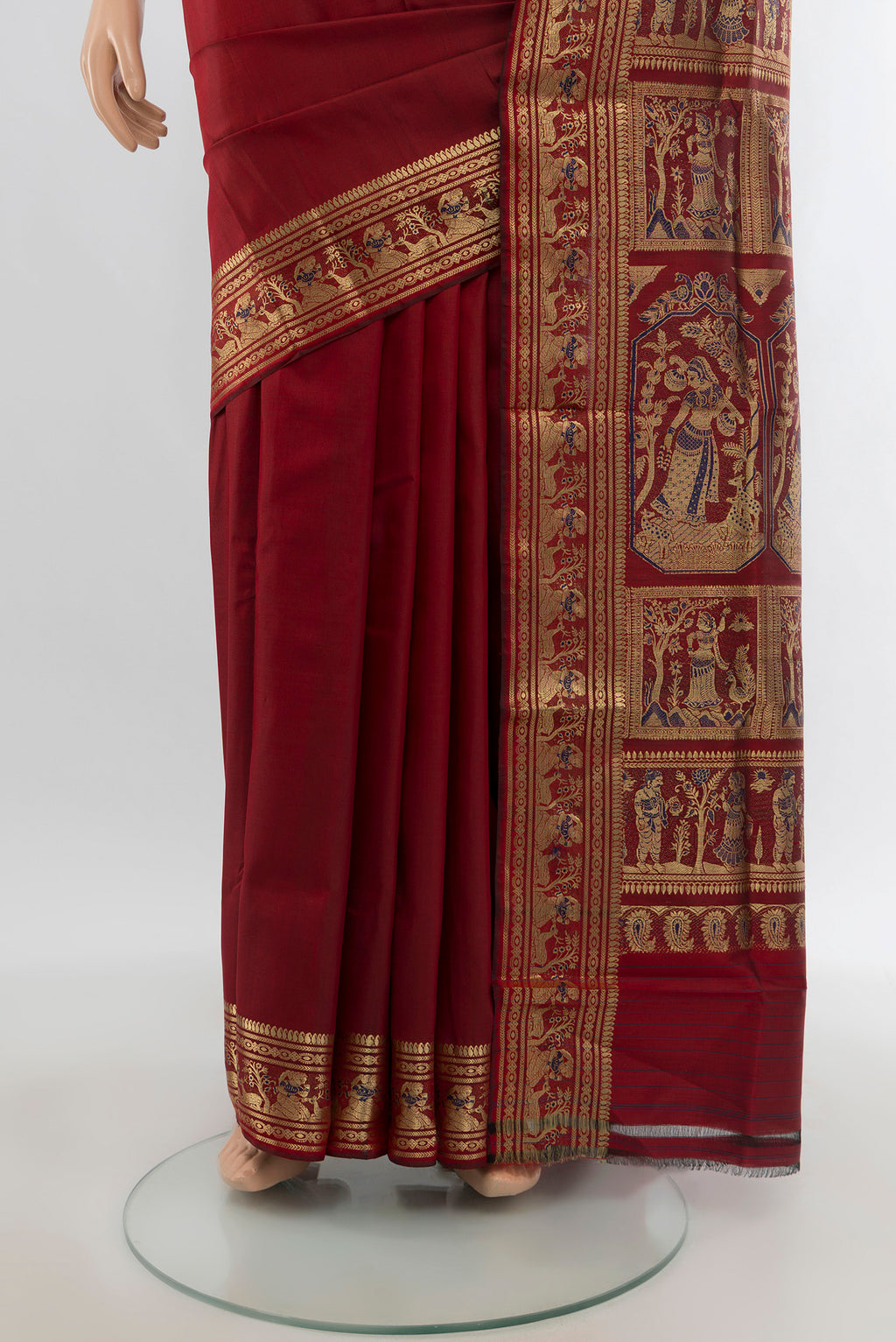 Pleats and pallu of Maroon Baluchari Silk Saree with Zari Butta on the body and Zari Border. 