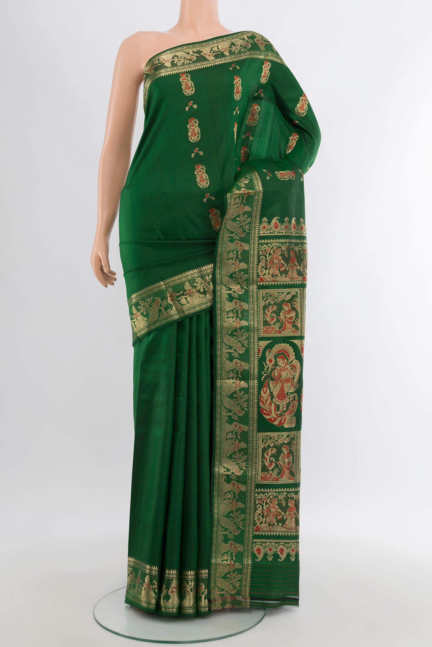 Green Baluchari Silk Saree with Zari And Thread Butta on the body and Zari Border.  displayed on a mannequin