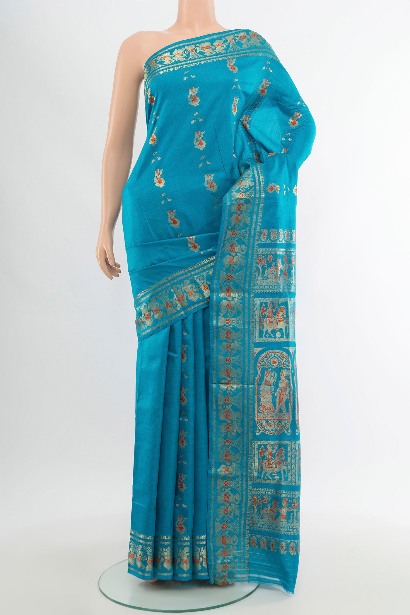 Blue Baluchari Silk Saree with Zari And Thread Butta on the body and Zari Border.  displayed on a mannequin