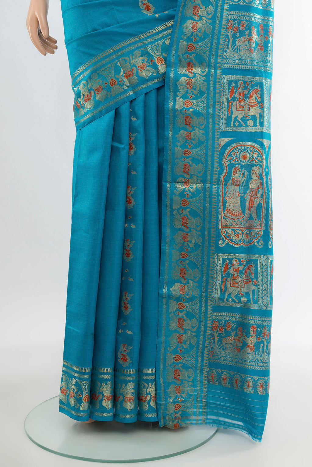Pleats and pallu of Blue Baluchari Silk Saree with Zari And Thread Butta on the body and Zari Border. 