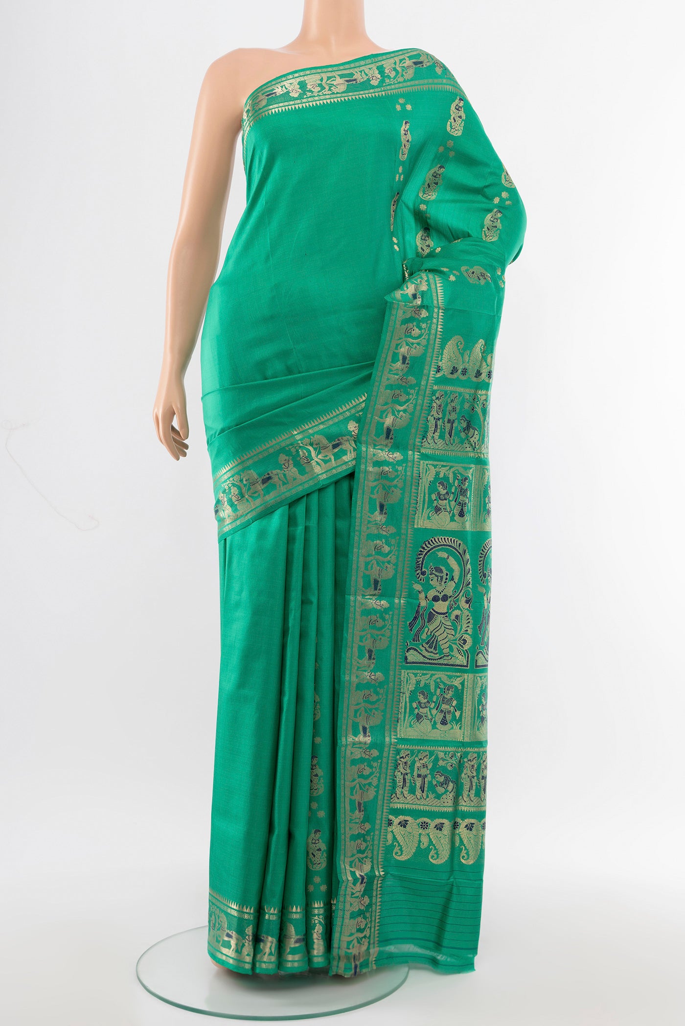 Light Green Baluchari Silk Saree with Zari Butta on the body and Silk Border.  displayed on a mannequin