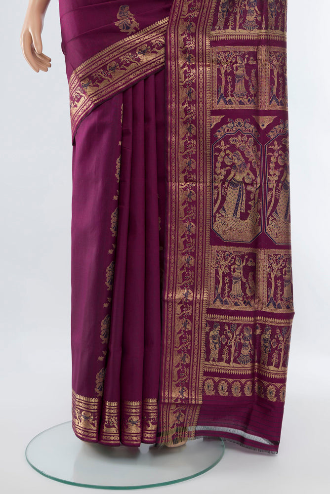Pleats and pallu of Purple Baluchari Silk Saree with Zari Butta on the body and Silk Border. 