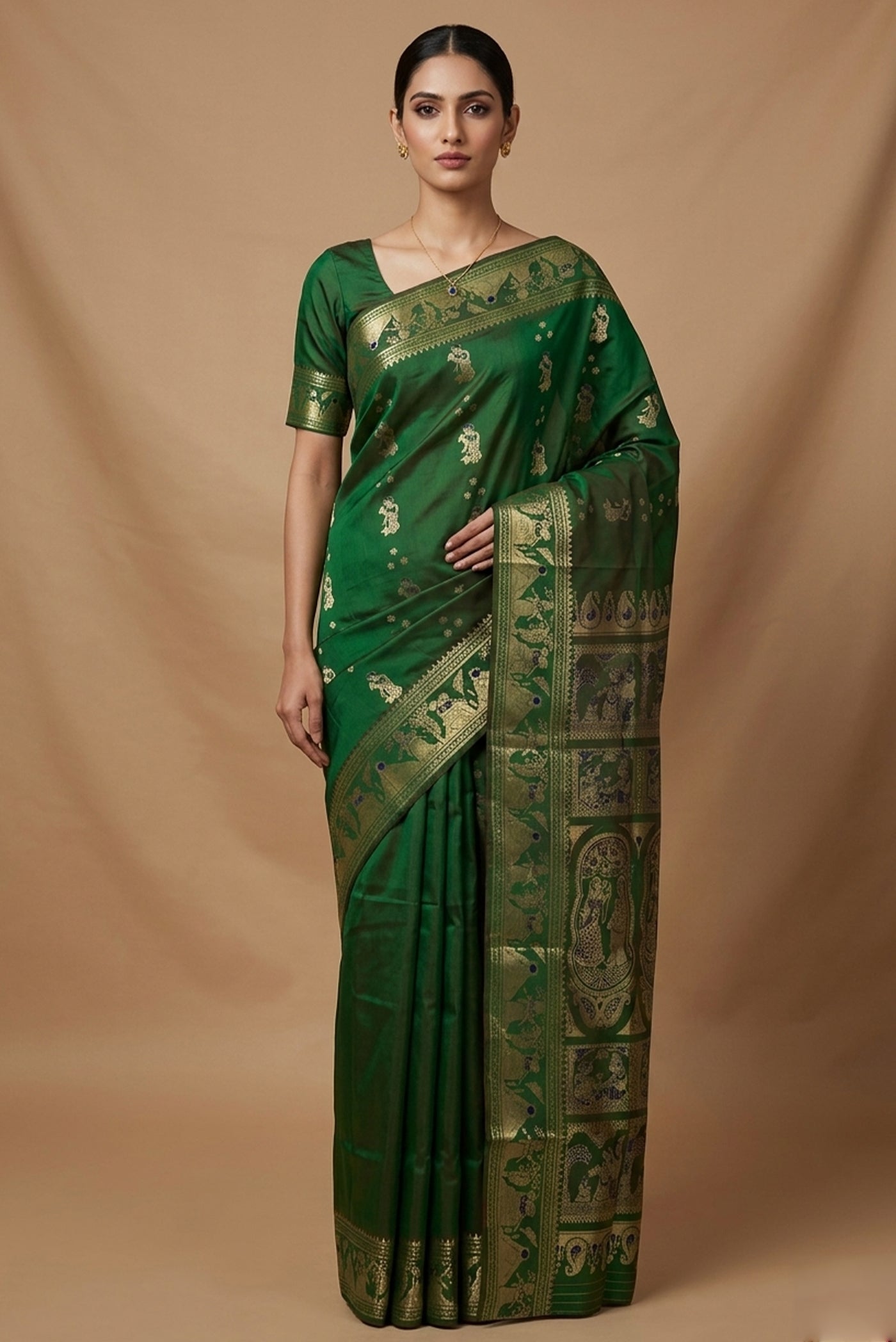 Model wearing a Green Baluchari Silk Saree with Zari And Thread Butta on the body and Zari Border.