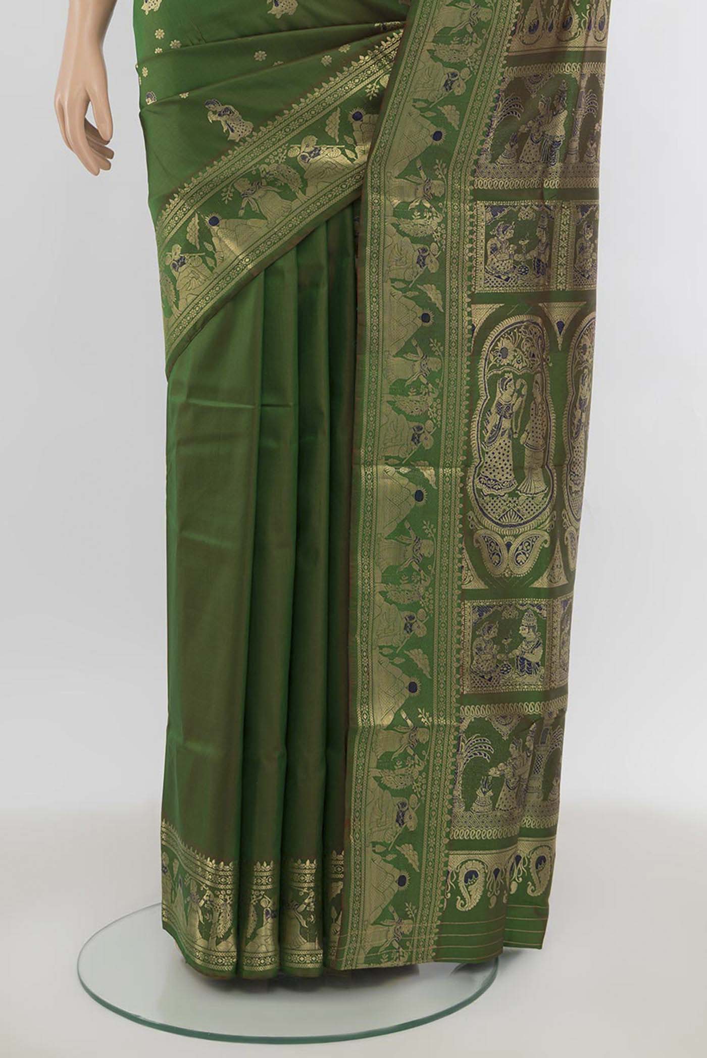 Pleats and pallu of Mint Green Baluchari Silk Saree with Zari Butta on the body and Silk Border. 