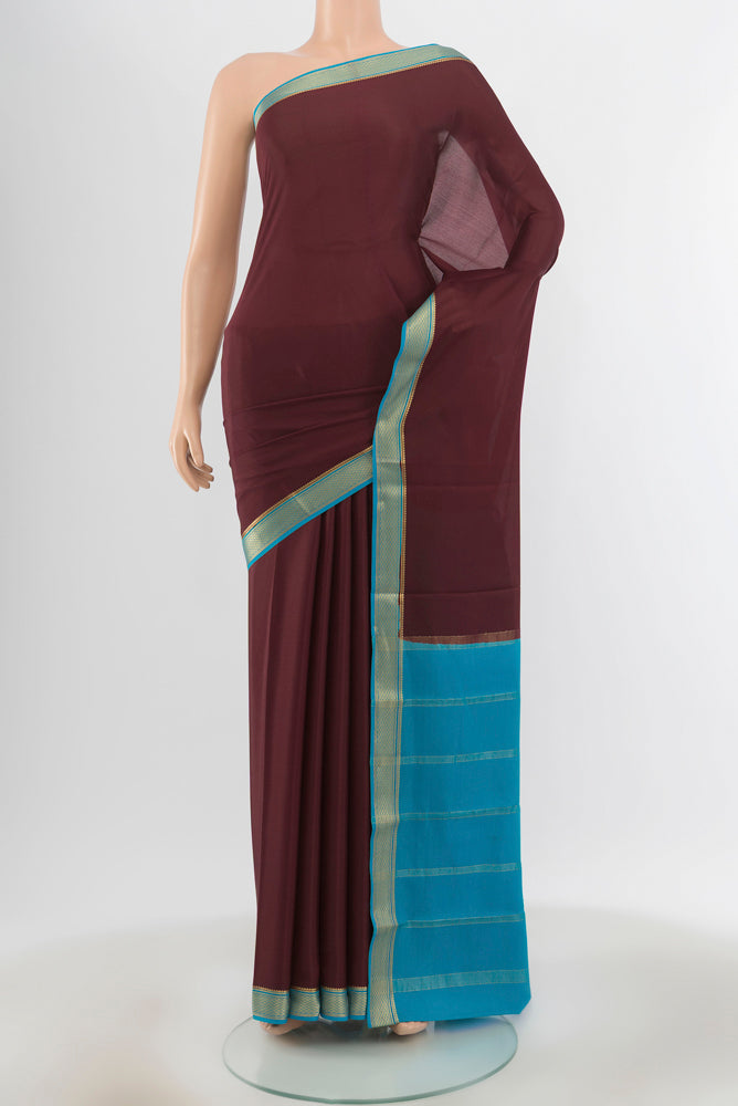 Pure Silk Pure Zari Coffee Brown Mysore Crepe Saree with Zari Butta on the body and Silk Border.  displayed on a mannequin