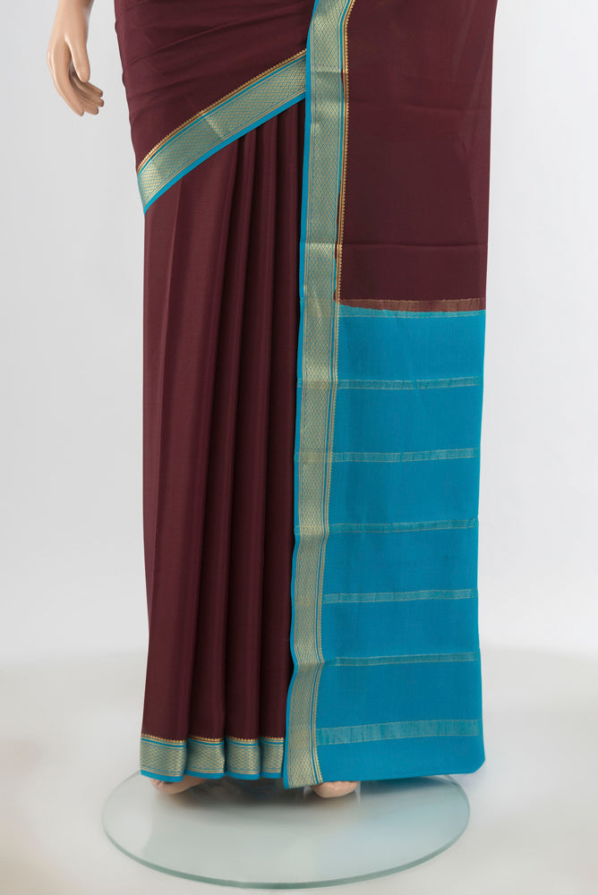 Pleats and pallu of Pure Silk Pure Zari Coffee Brown Mysore Crepe Saree with Zari Butta on the body and Silk Border. 