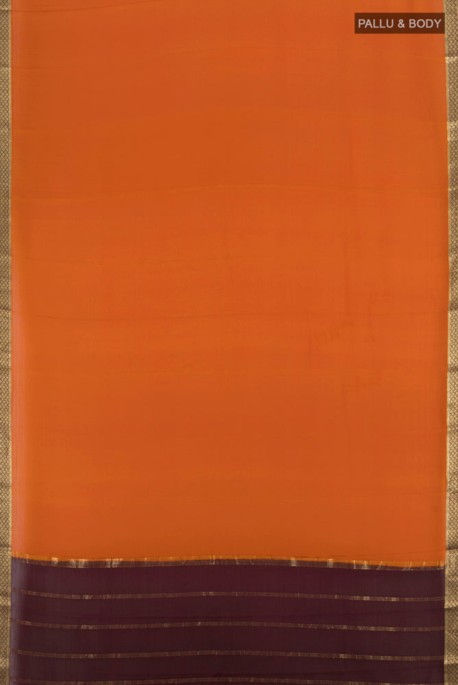 Flat view of Rust Mysore Crepe Saree with Plain Body and Silk Border. 