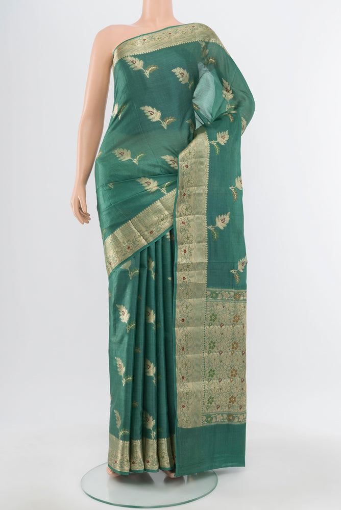 Pure Silk Pure Zari Olive Green Banarasi Raw Saree with Zari Butta on the body and Silk Border.  displayed on a mannequin