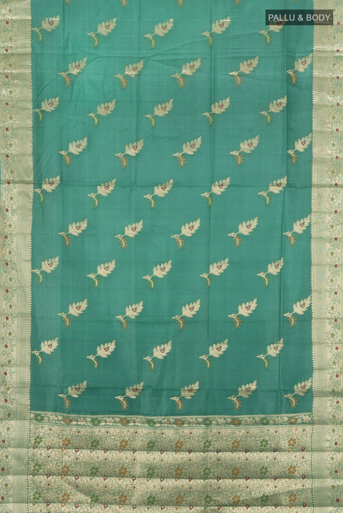 Flat view of Pure Silk Pure Zari Olive Green Banarasi Raw Saree with Zari Butta on the body and Silk Border. 
