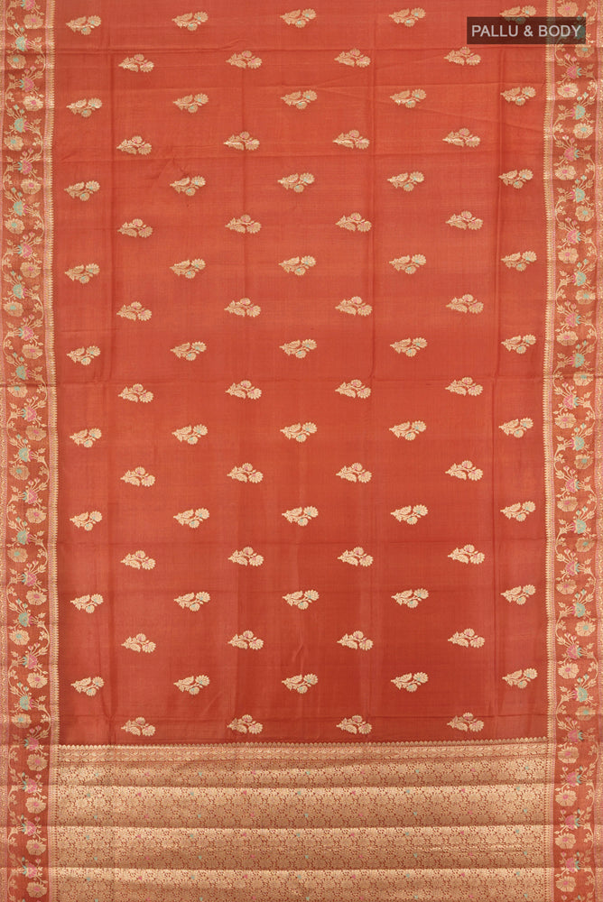 Flat view of Pure Silk Pure Zari Rust Banarasi Raw Saree with Zari Butta on the body and Silk Border. 