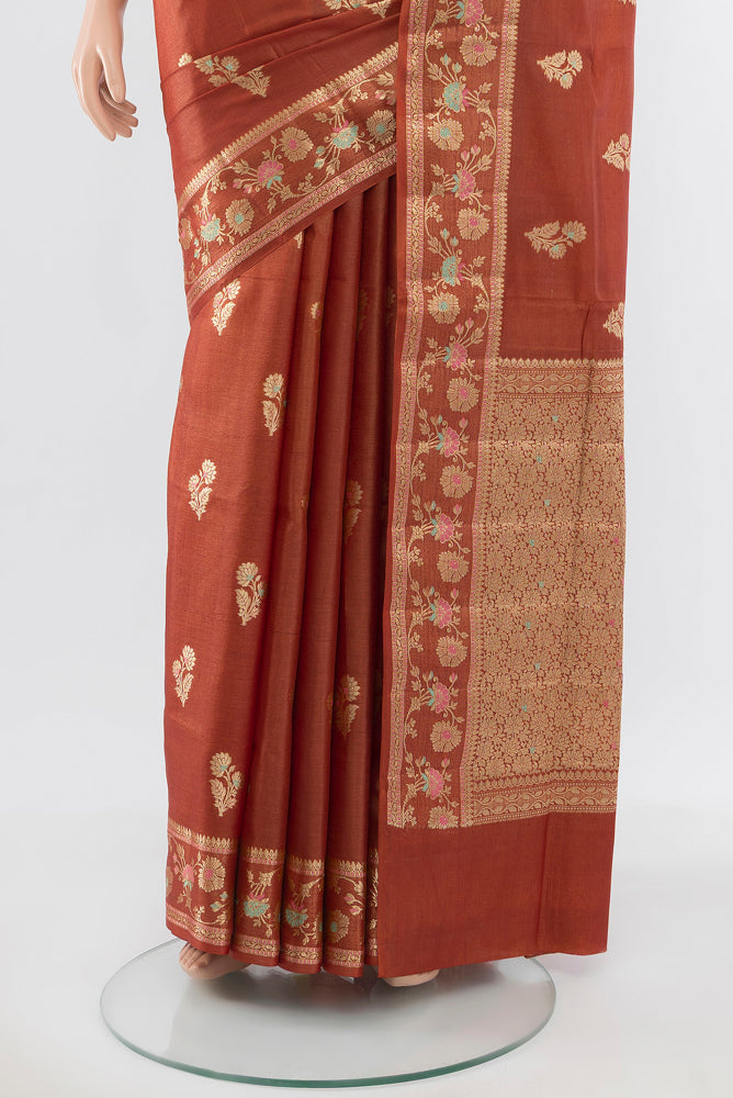 Pleats and pallu of Pure Silk Pure Zari Rust Banarasi Raw Saree with Zari Butta on the body and Silk Border. 