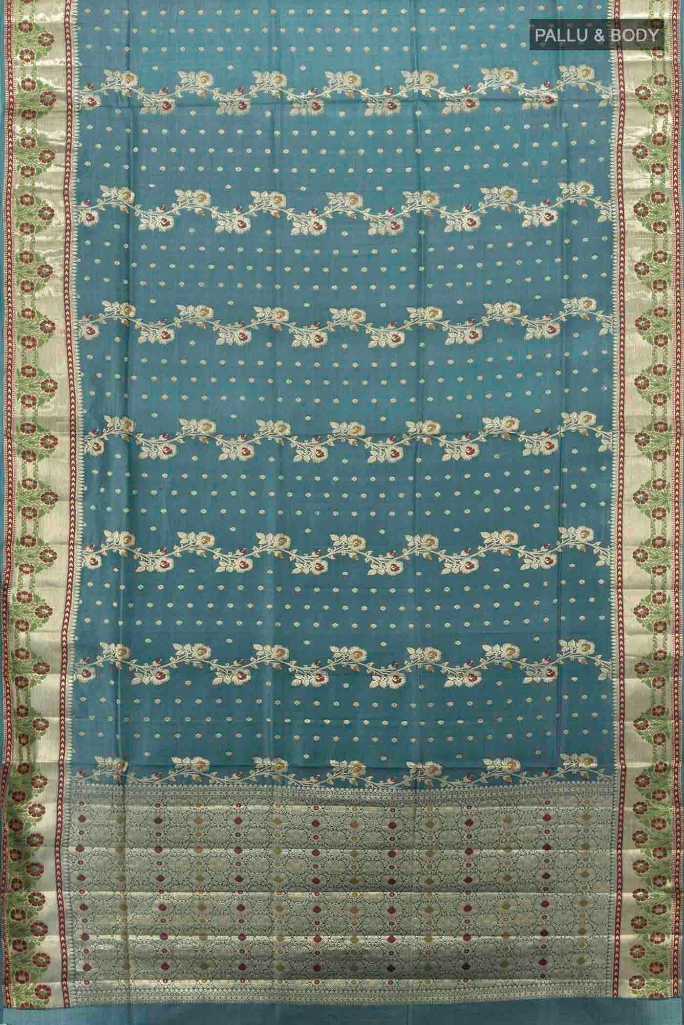 Flat view of Light Blue Banarasi Raw Silk Saree with Zari Butta on the body and Silk Border
