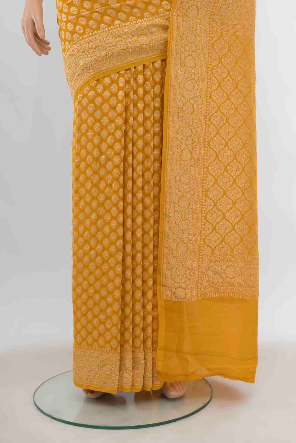Pleats and pallu of Yellow Banarasi Georgette Saree with Zari Butta on the body and Silk Border