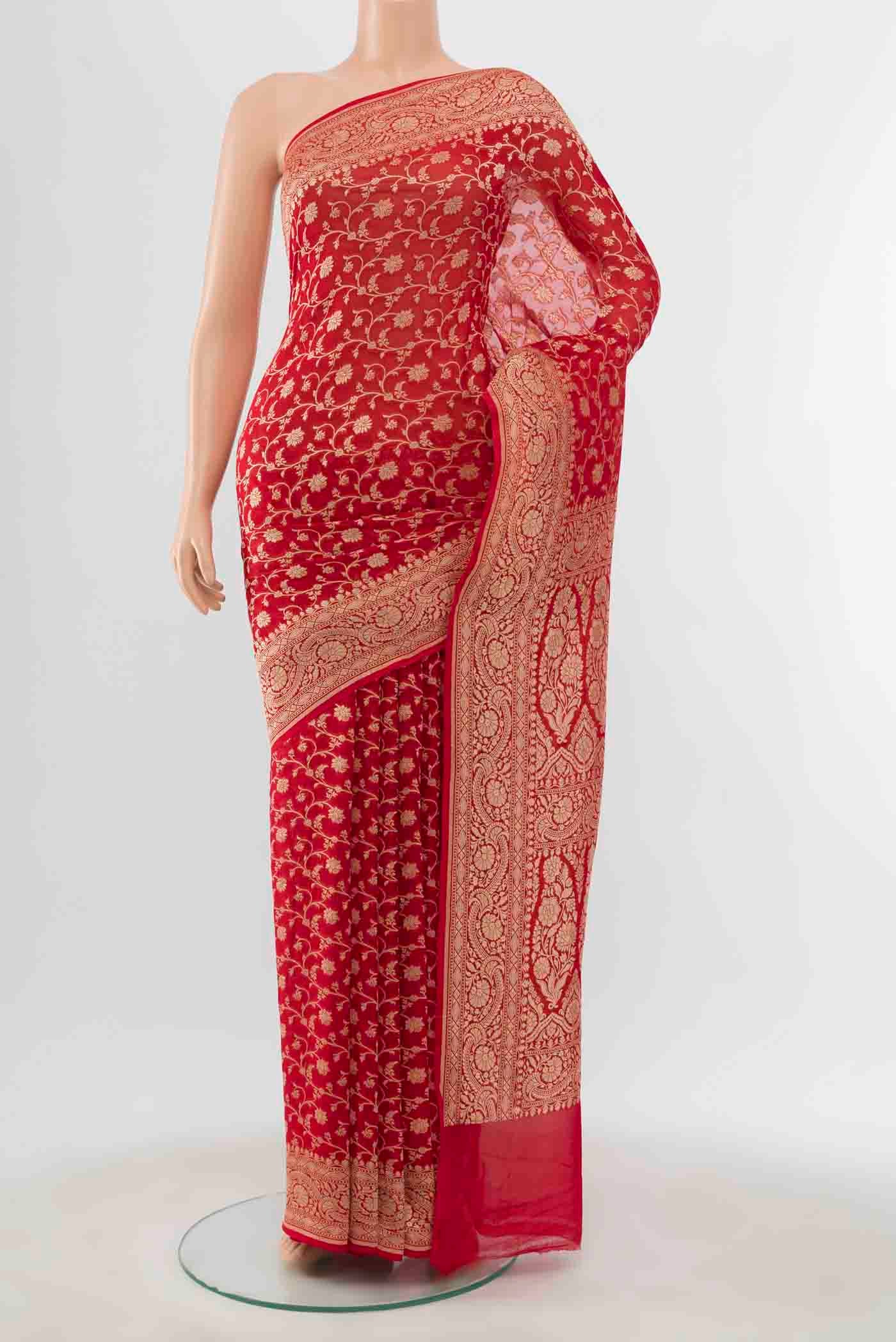 Red Banarasi Georgette Saree with Zari Brocade on the body and Zari Border displayed on a mannequin