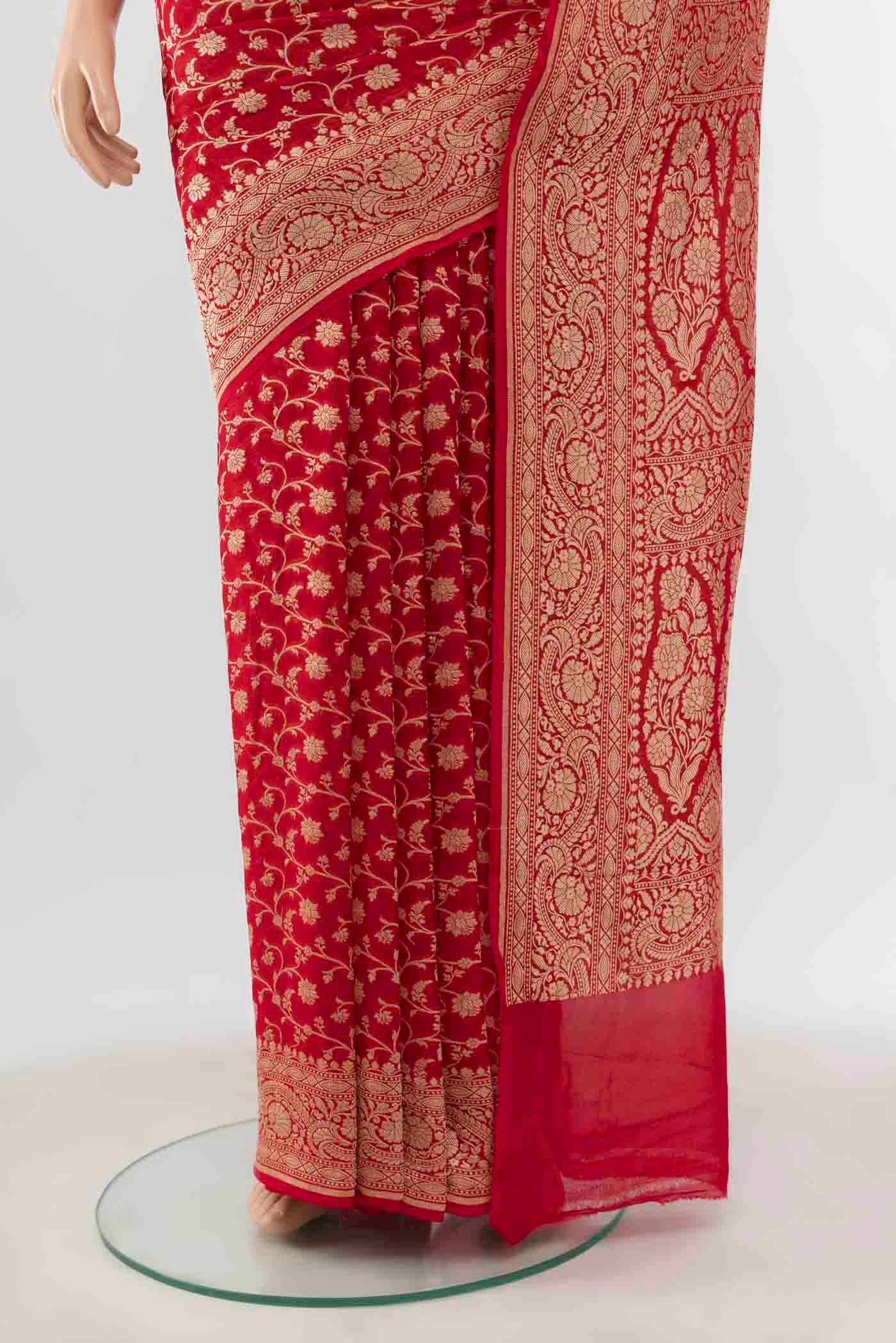 Pleats and pallu of Red Banarasi Georgette Saree with Zari Brocade on the body and Zari Border