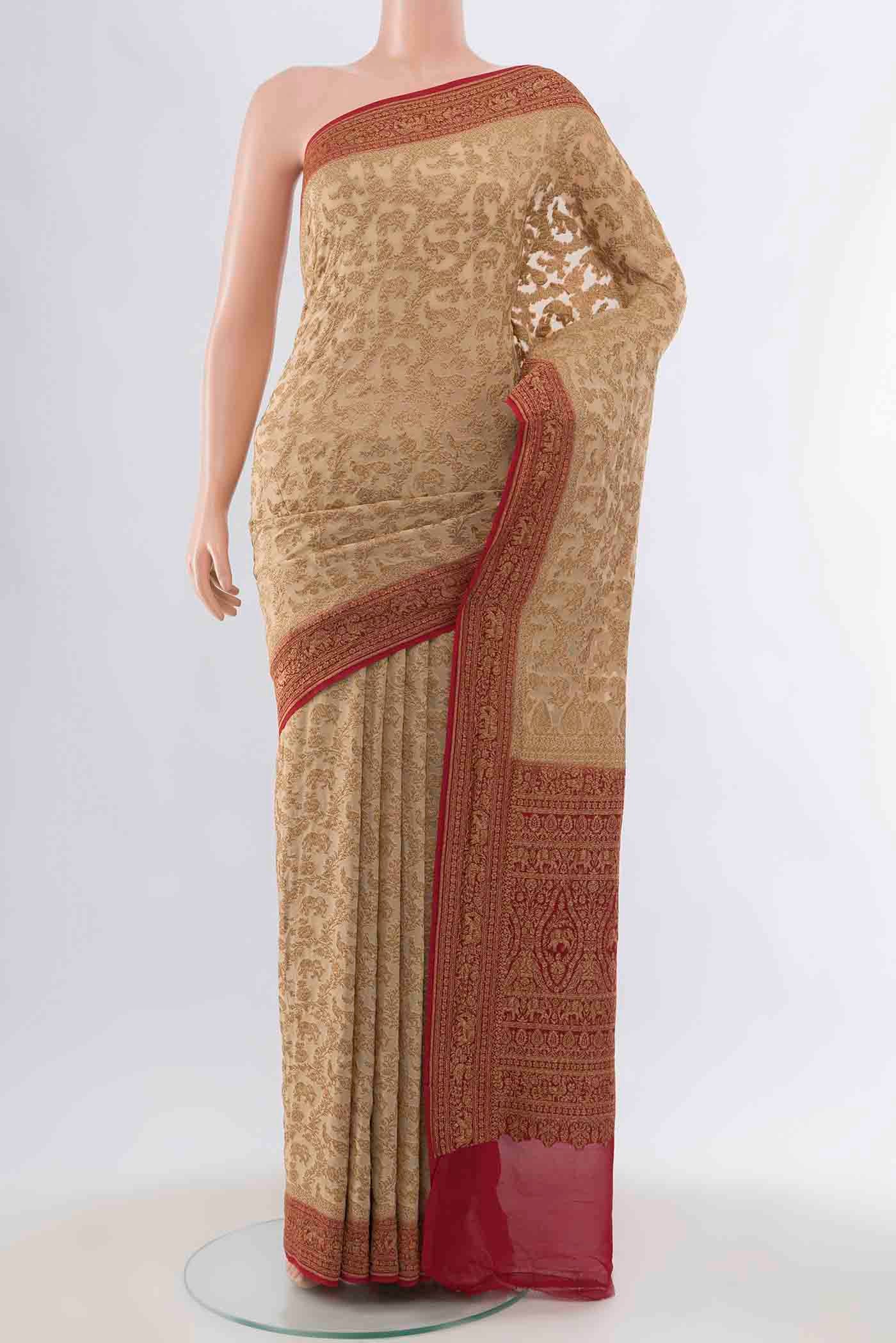 Beige Banarasi Georgette Saree with Zari Brocade on the body and Zari Border displayed on a mannequin