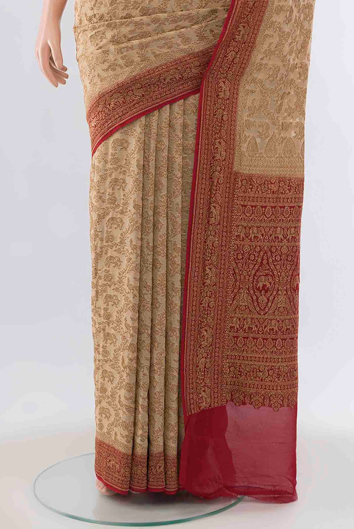 Pleats and pallu of Beige Banarasi Georgette Saree with Zari Brocade on the body and Zari Border