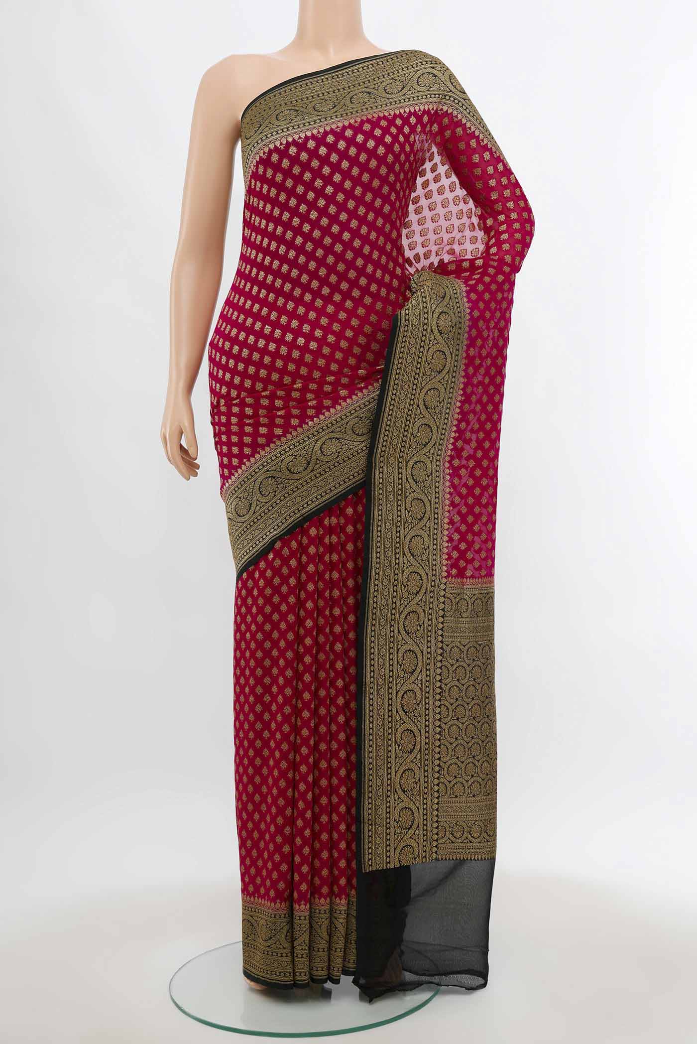 Purple Banarasi Georgette Saree with Zari Butta on the body and Silk Border.  displayed on a mannequin