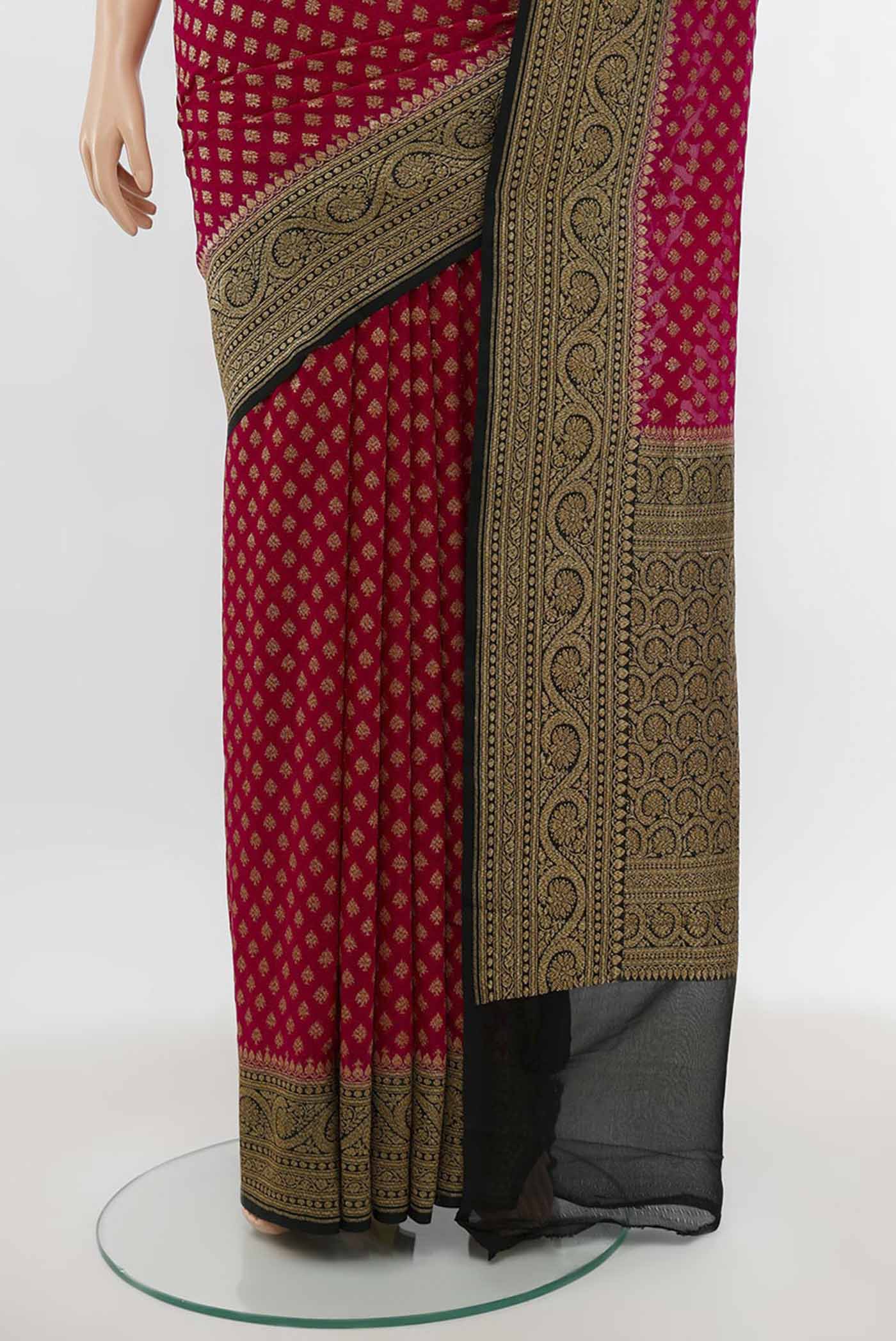 Pleats and pallu of Purple Banarasi Georgette Saree with Zari Butta on the body and Silk Border. 