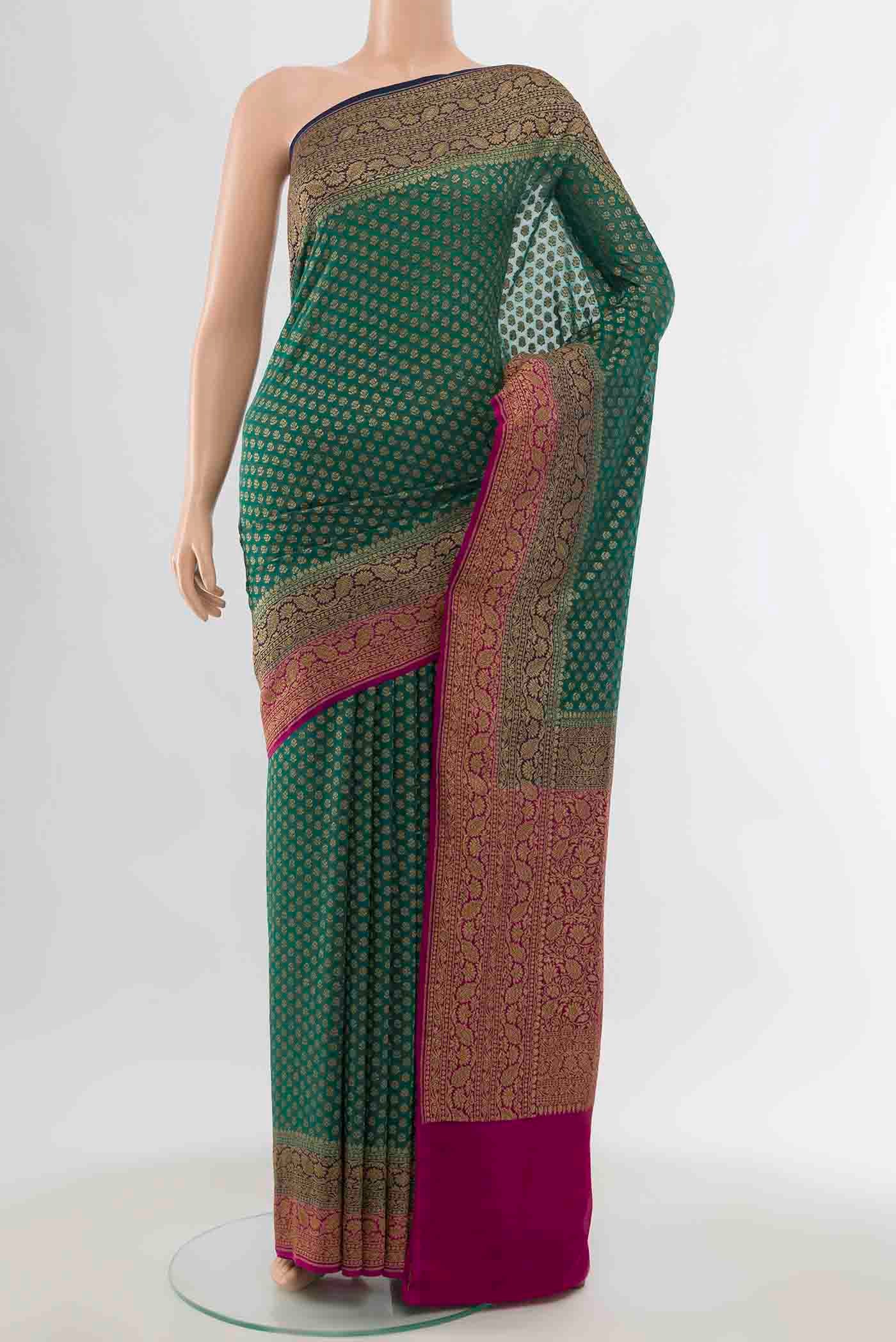 Blue Banarasi Georgette Saree with Zari Brocade on the body and Zari Border displayed on a mannequin