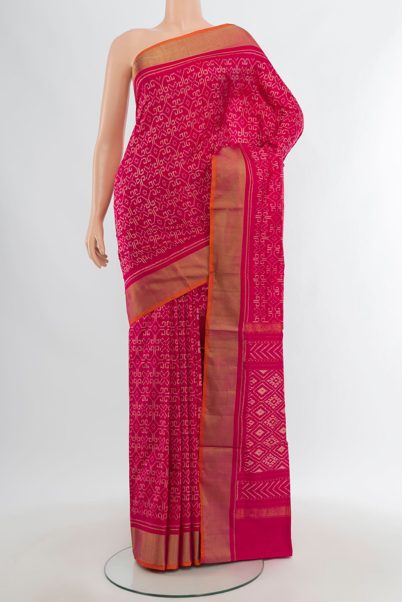 Dark Pink Pochampally Silk Saree with Pure Ikat on the body and Zari Border.  displayed on a mannequin
