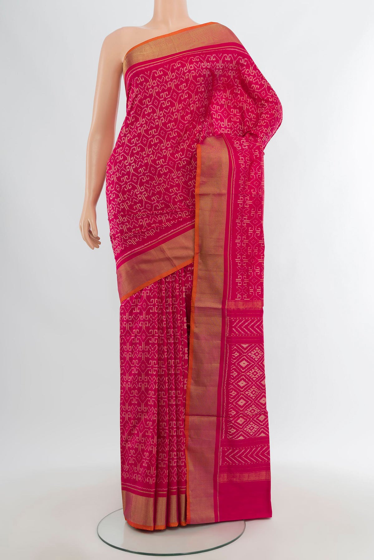 Dark Pink Pochampally Silk Saree with Pure Ikat on the body and Zari Border.  displayed on a mannequin