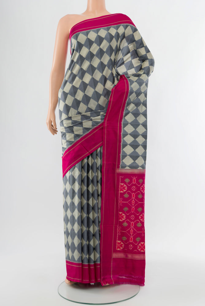 Davys Grey Pochampally Saree with Ikat Print on the body and Silk Border.  displayed on a mannequin