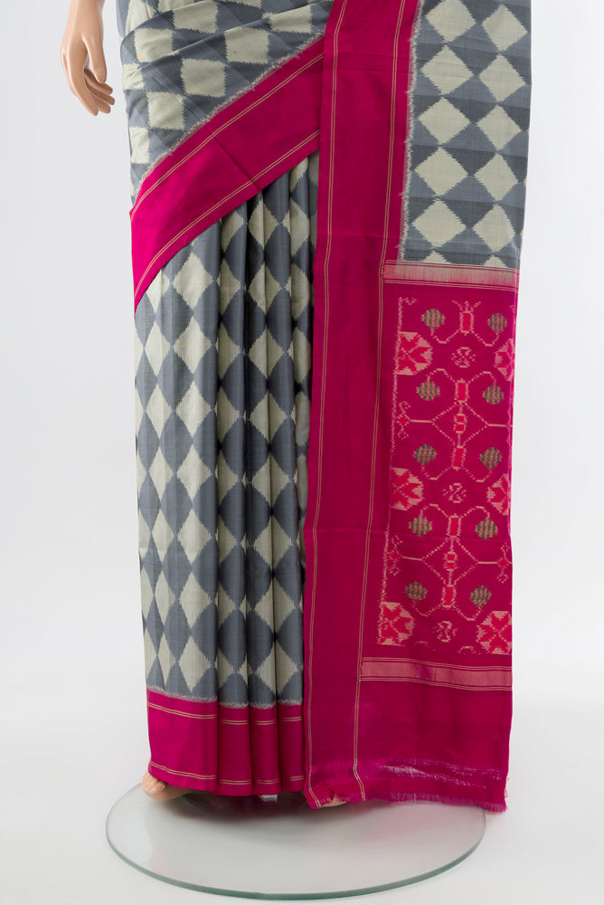 Pleats and pallu of Davys Grey Pochampally Saree with Ikat Print on the body and Silk Border. 