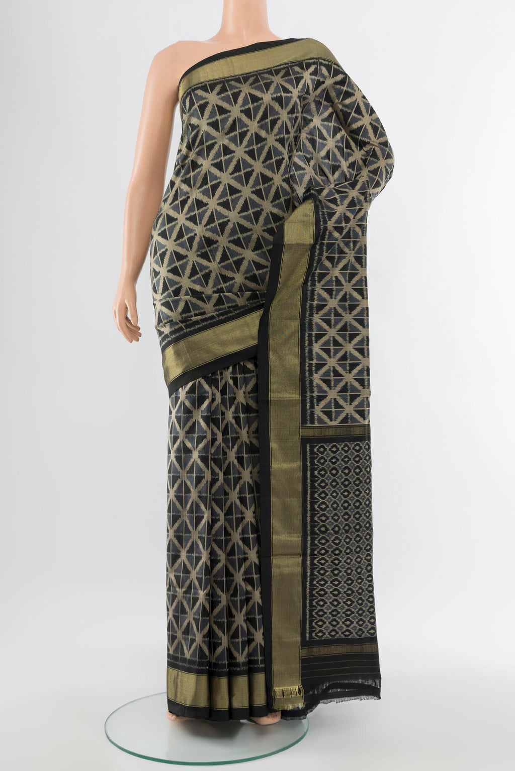 Black Pochampally Saree with Ikat Print on the body and Silk Border.  displayed on a mannequin