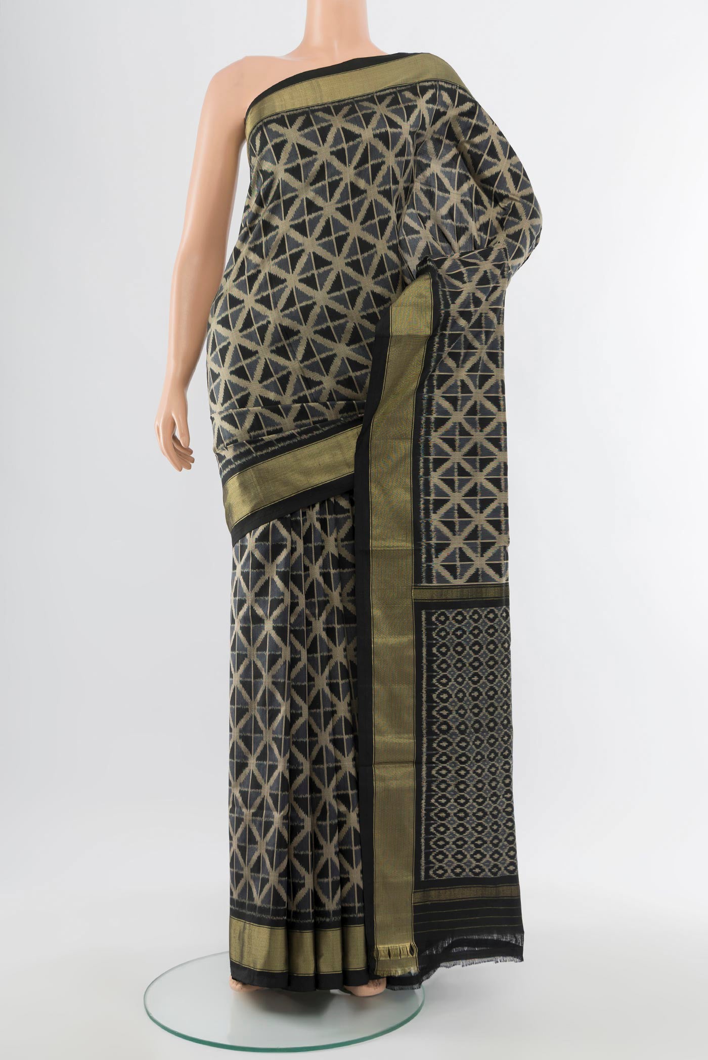 Black Pochampally Saree with Ikat Print on the body and Silk Border.  displayed on a mannequin