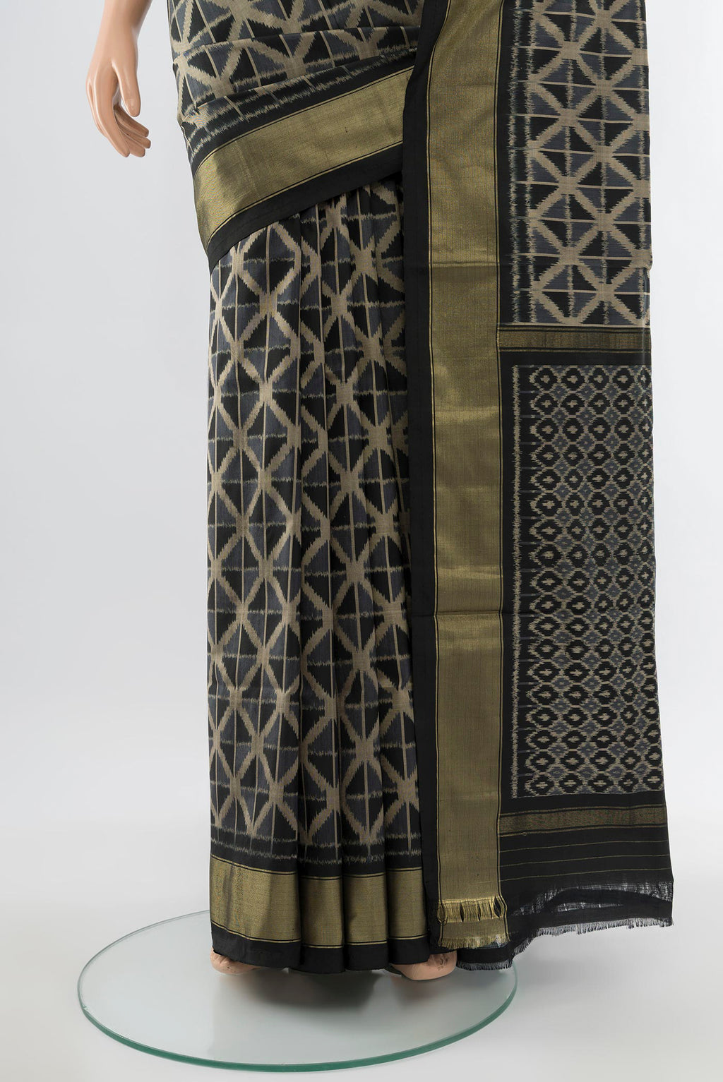 Pleats and pallu of Black Pochampally Saree with Ikat Print on the body and Silk Border. 