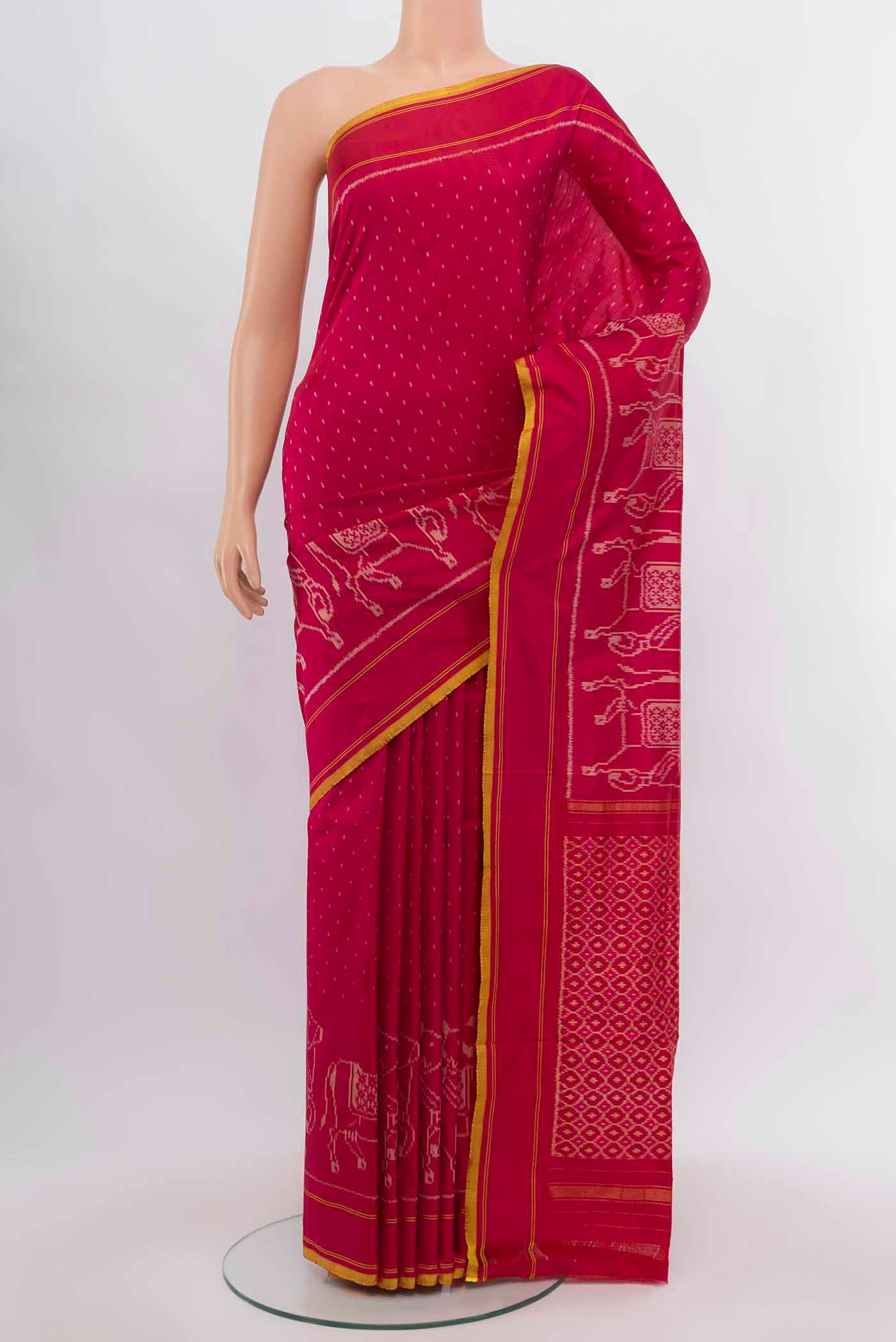 Rani Pink Pochampally Saree with Ikat Print on the body and Silk Border.  displayed on a mannequin