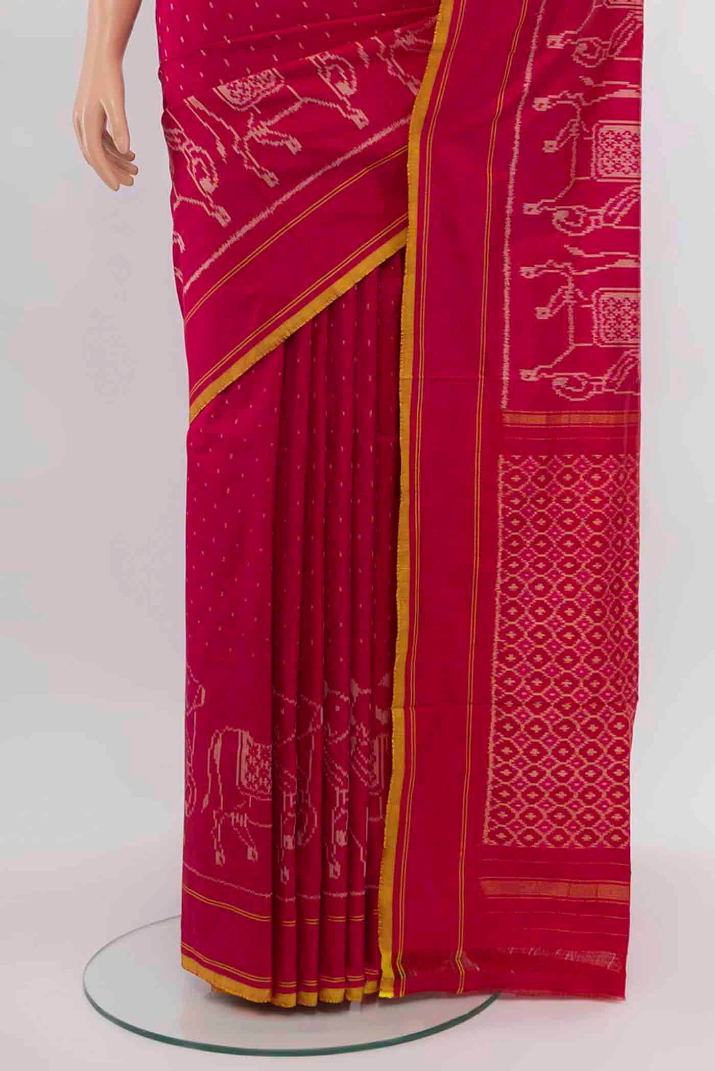Pleats and pallu of Rani Pink Pochampally Saree with Ikat Print on the body and Silk Border. 
