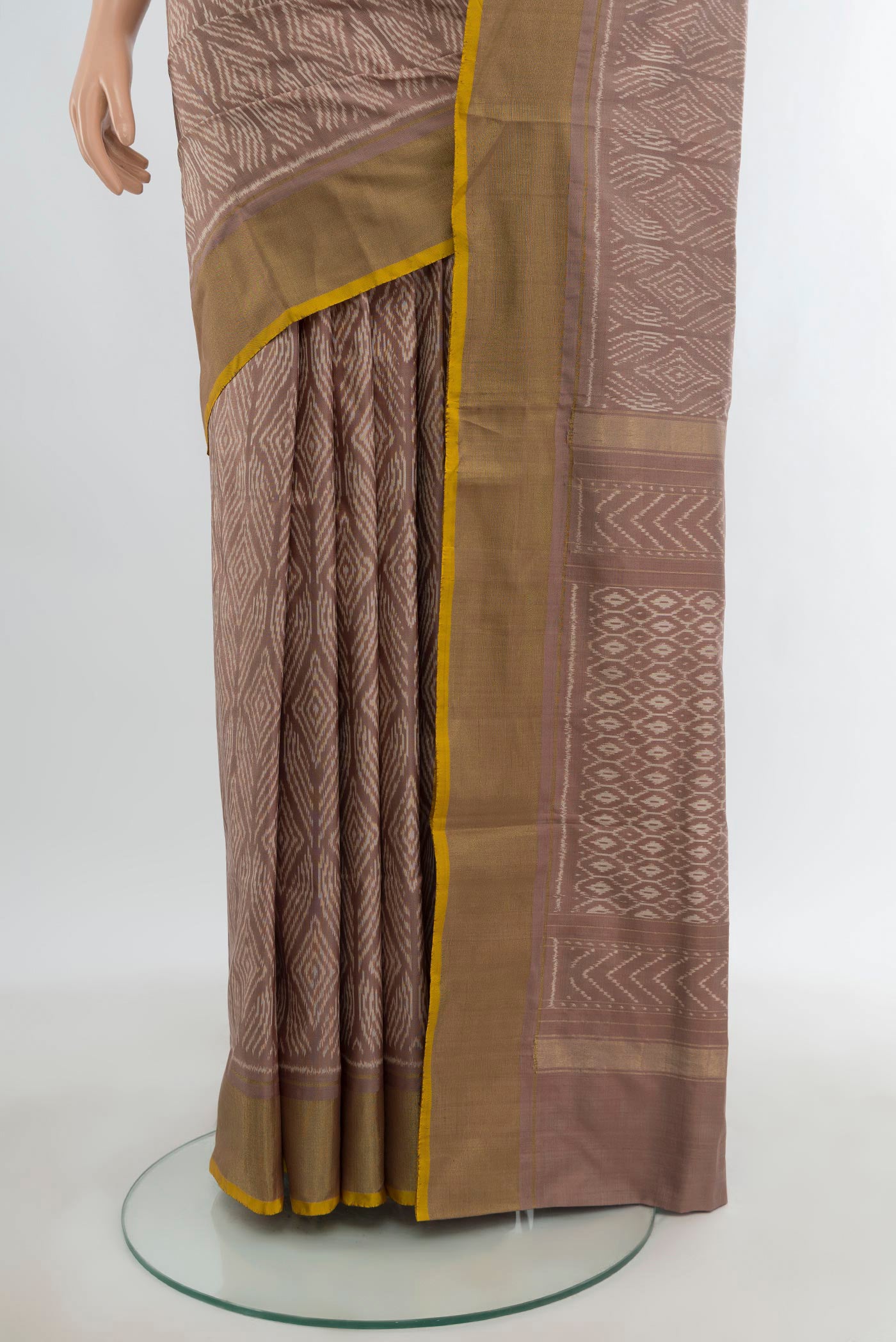 Pleats and pallu of Mauve Pochampally Silk Saree with Pure Ikat on the body and Zari Border. 