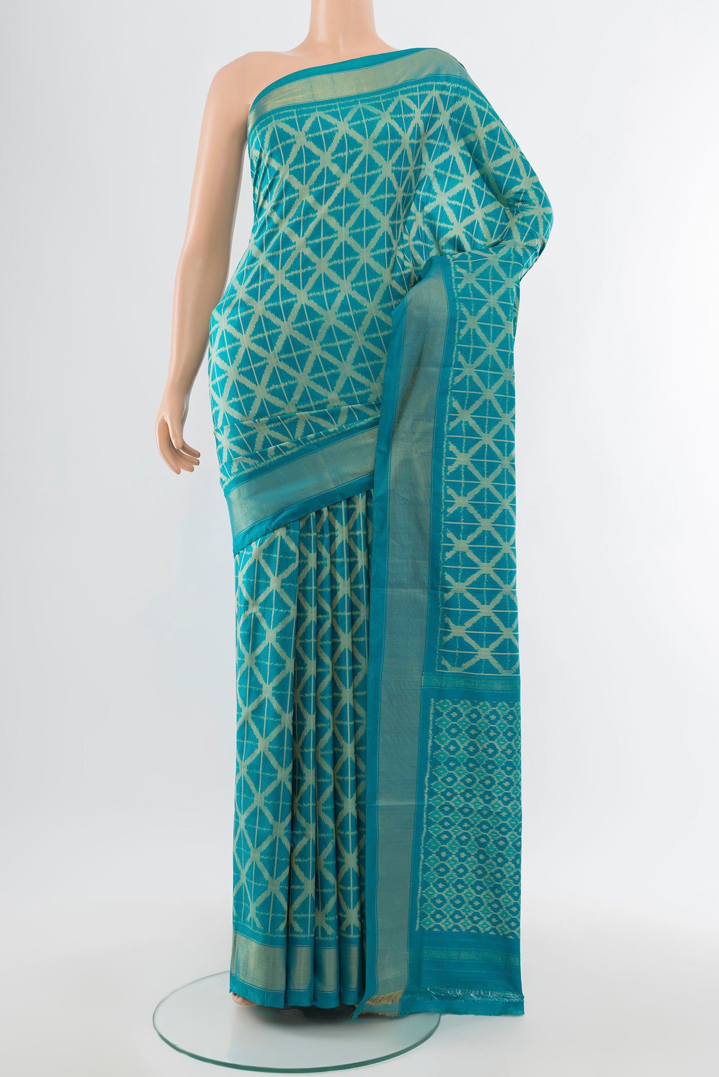 Light Blue Pochampally Saree with Ikat Print on the body and Silk Border.  displayed on a mannequin