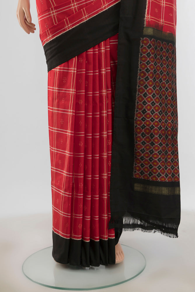 Pleats and pallu of Pure Silk Pure Zari Red Pochampally Saree with Ikat Print on the body and Silk Border. 