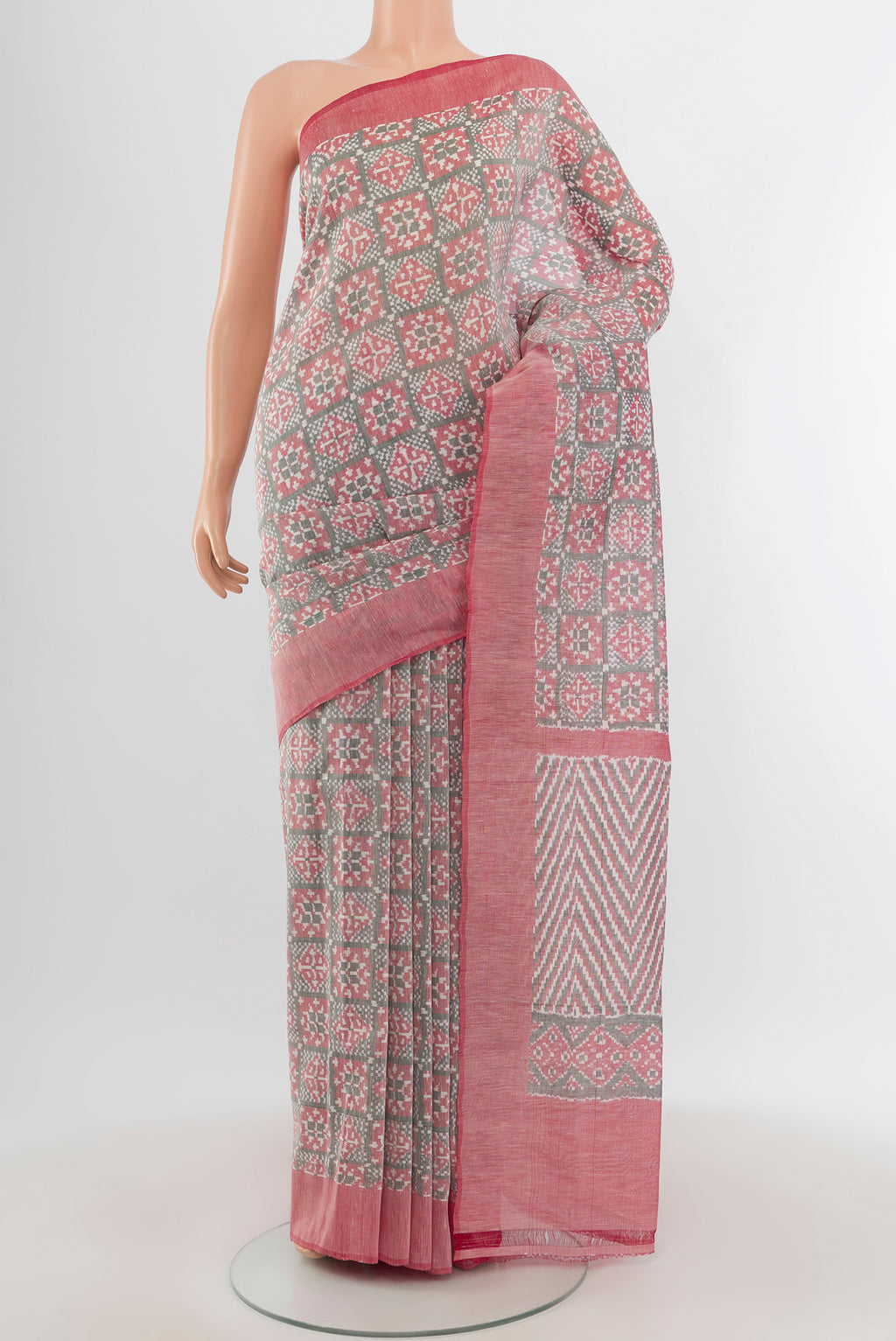 Grey Pochampally Cotton Saree with Ikat Print on the body and Plain Border.  displayed on a mannequin
