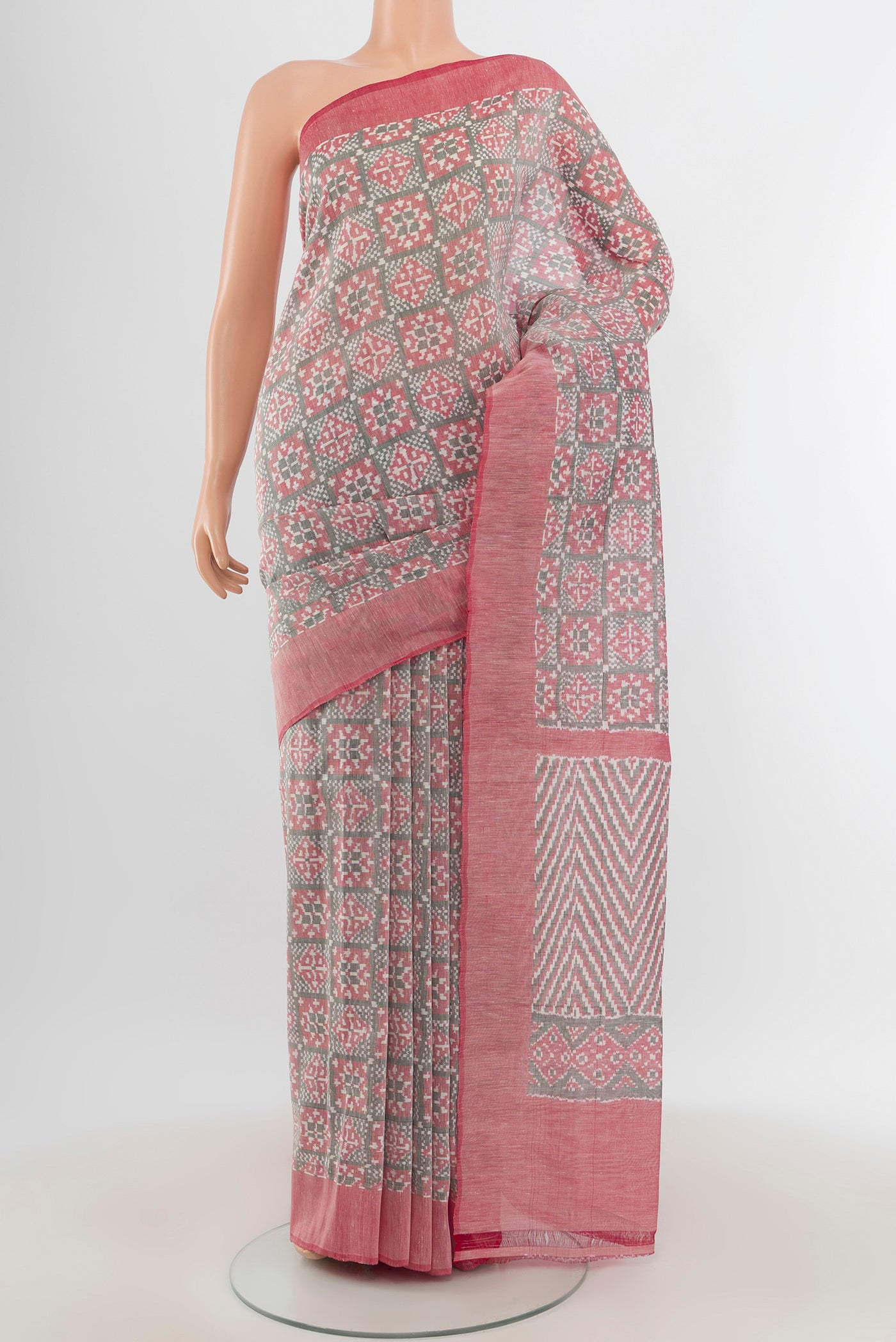 Grey Pochampally Cotton Saree with Ikat Print on the body and Plain Border.  displayed on a mannequin