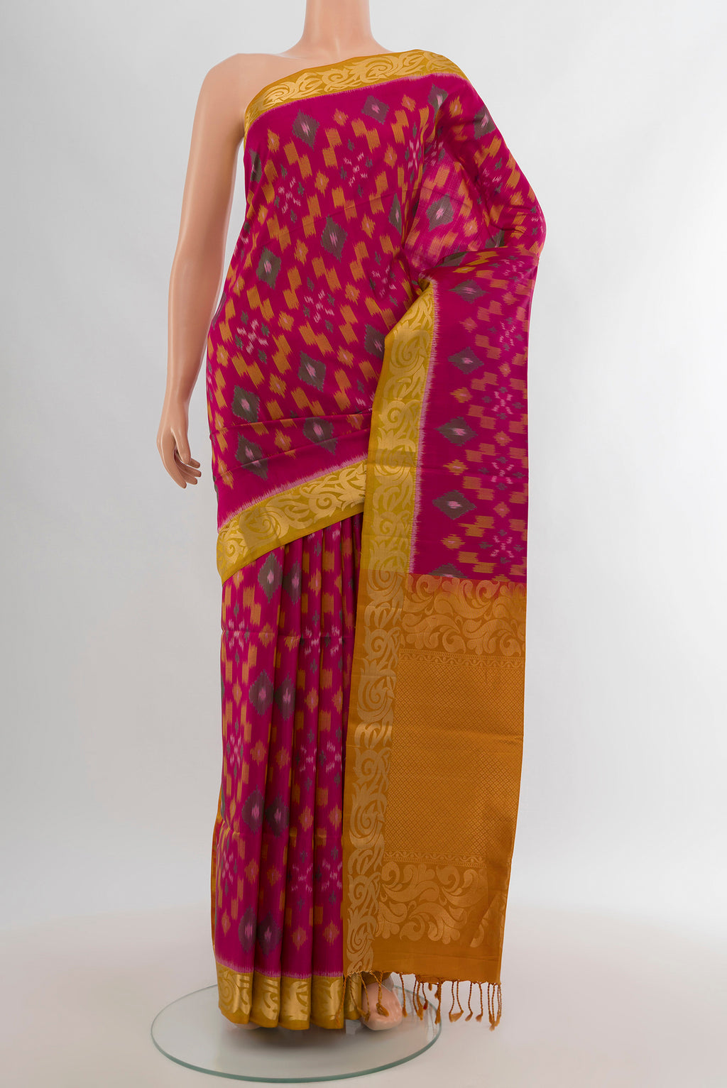 Dark Pink Soft Silk Saree with Ikat Print on the body and Zari Border.  displayed on a mannequin