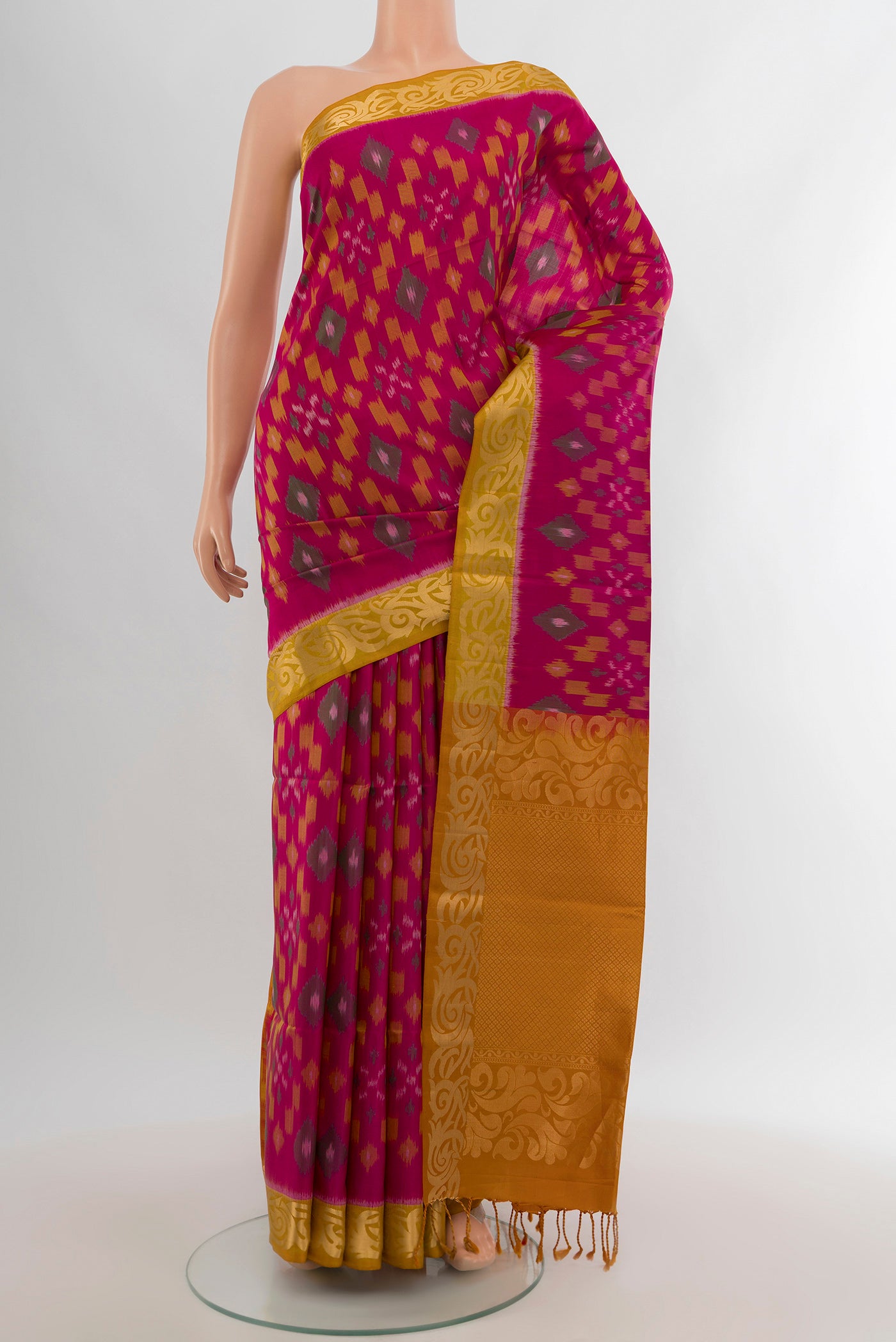 Dark Pink Soft Silk Saree with Ikat Print on the body and Zari Border.  displayed on a mannequin