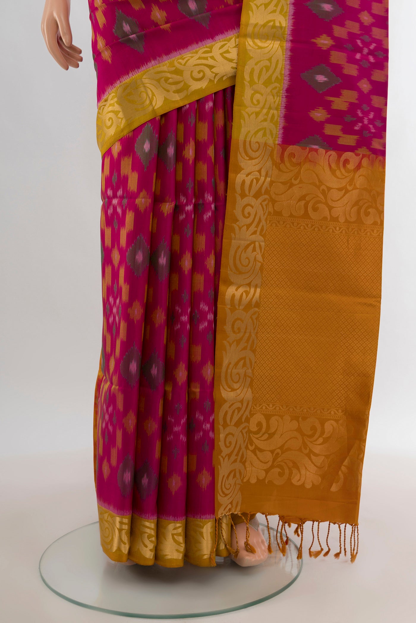 Pleats and pallu of Dark Pink Soft Silk Saree with Ikat Print on the body and Zari Border. 