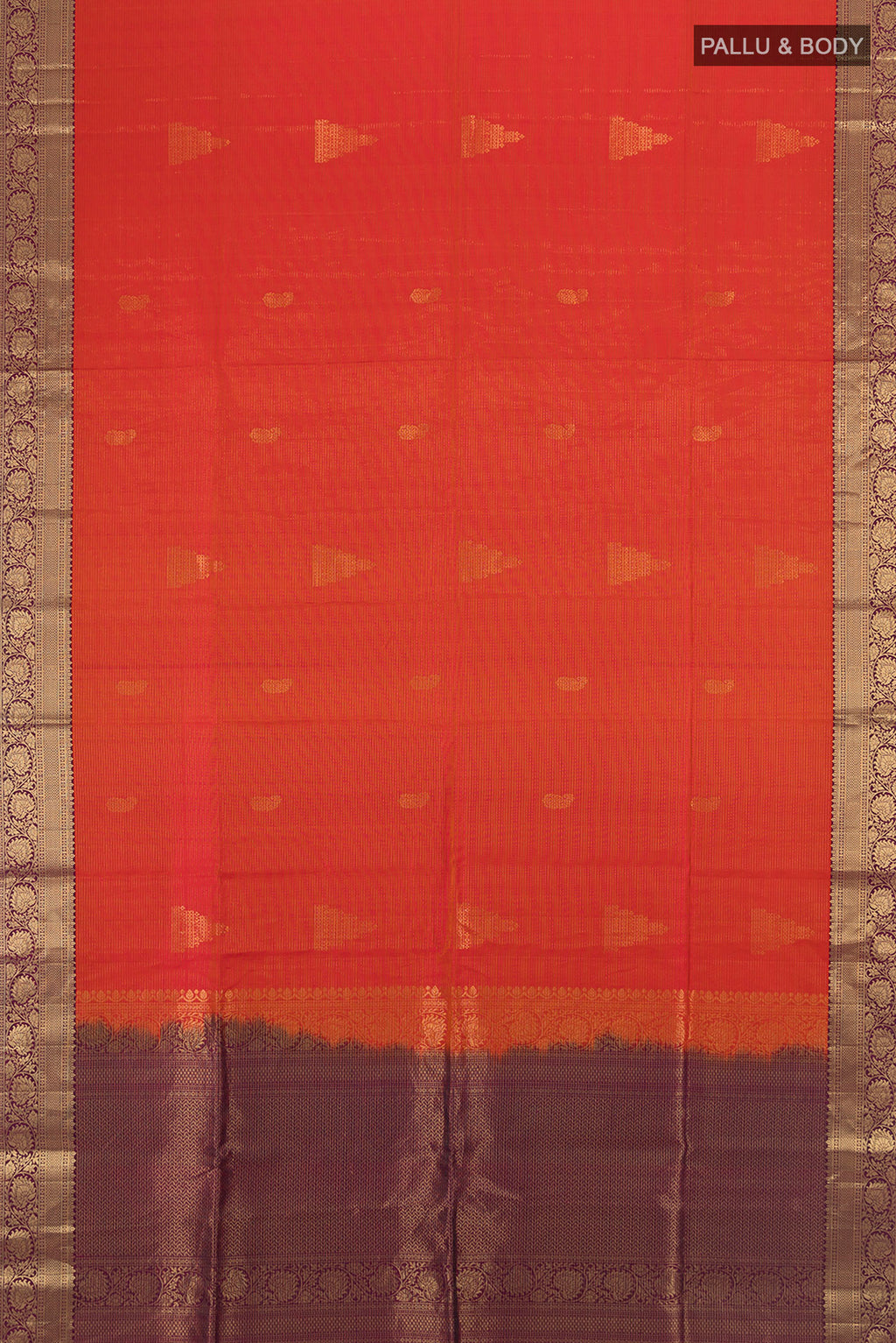 Flat view of Brick Orange Soft Silk Saree with Zari Butta on the body and Zari Border. 