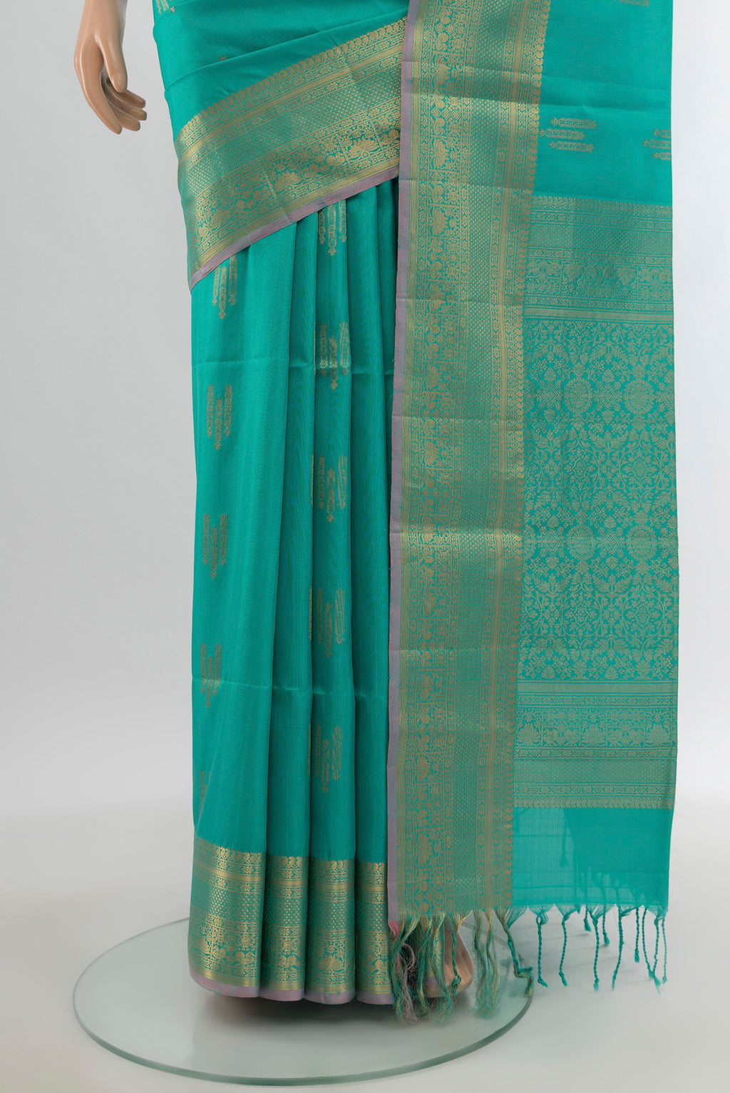 Pleats and pallu of Sky Blue Soft Silk Saree with Zari Butta on the body and Zari Border. 