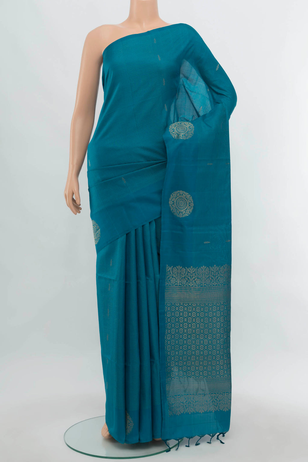 Light Blue Soft Silk Saree with Zari Butta on the body and Silk Border.  displayed on a mannequin