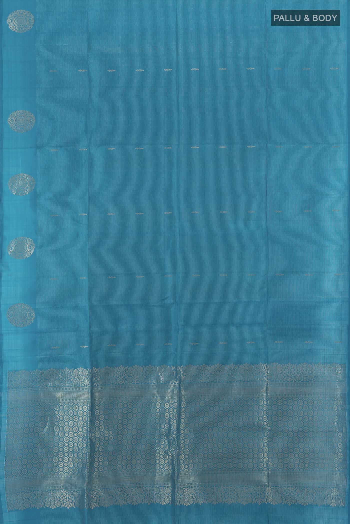 Flat view of Light Blue Soft Silk Saree with Zari Butta on the body and Silk Border. 