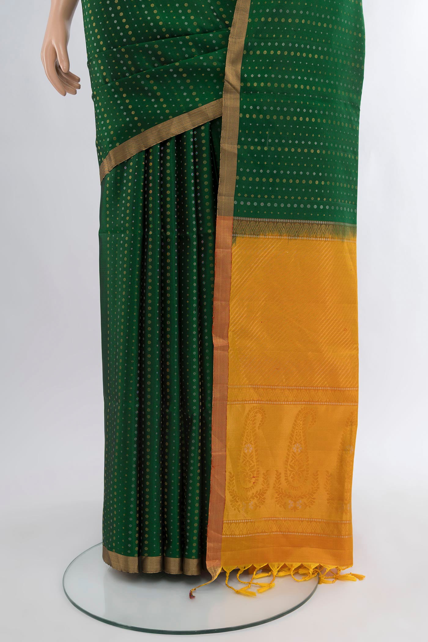 Pleats and pallu of Bottle Green Soft Silk Saree with Zari Butta on the body and Zari Border. 